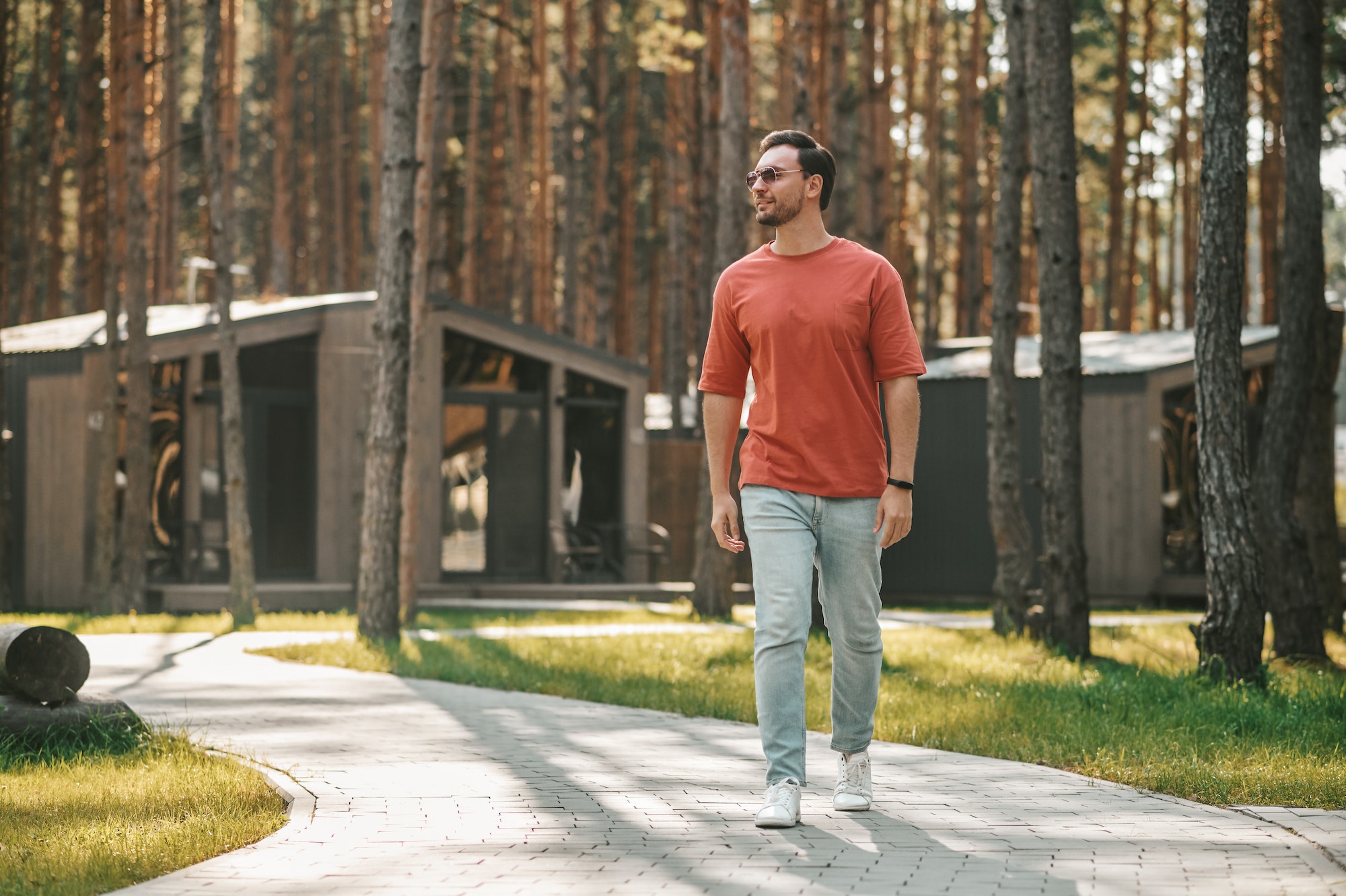 Young man walking in the park zone